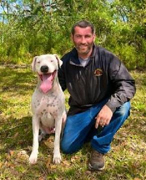 Anthony Pursel. shown here with his young Argentine Dogo, is one of Euro Pros' Certified Trainers that specializes in Obedience training and Behavior Modification.