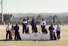This picture is of Linda Werlein and Arrk von Asgard on the podium at the All-Breed American Working Dog Federation (AWDF) Team Schutzhund Championship.