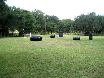 his is a look across Euro Pros K-9 Center's Training and Exercise Field. It is enclosed and has stadium lights for evening training and play. Your dog will have great time here running and playing with one of our Certified Trainers.